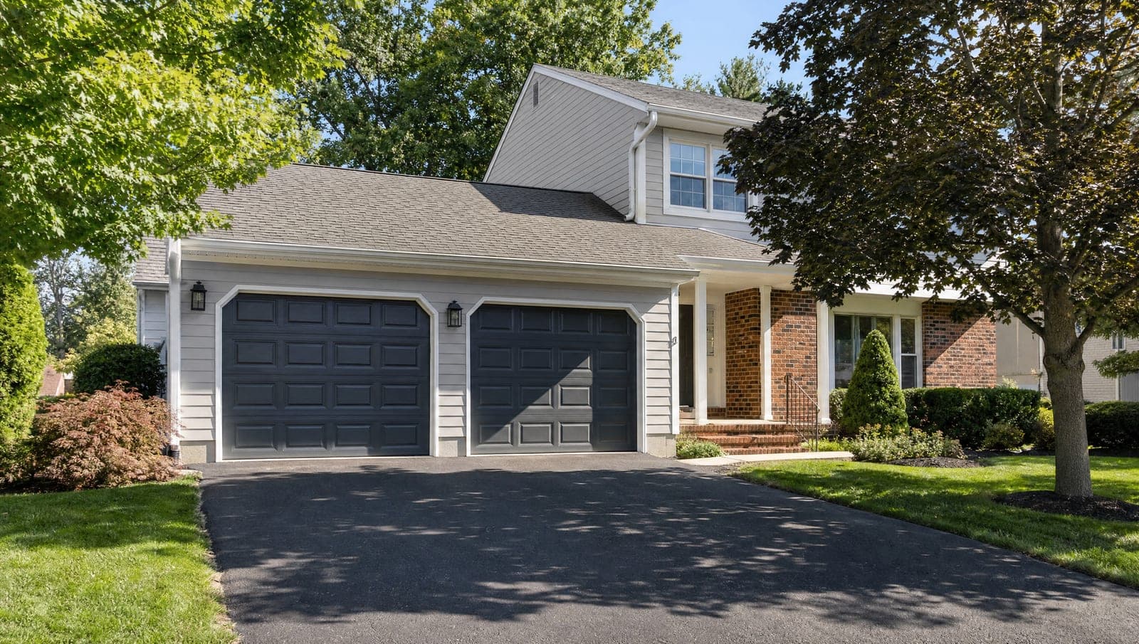 New insulated garage door on a suburban North Jersey home in daylight
